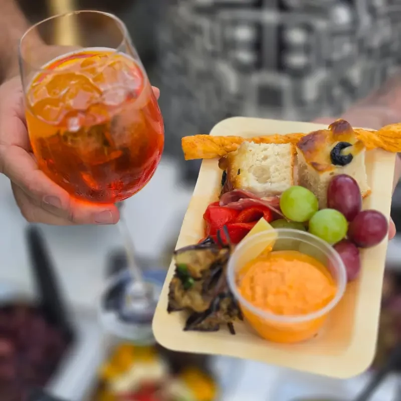Curated charcuterie serving board with fresh produce and dips