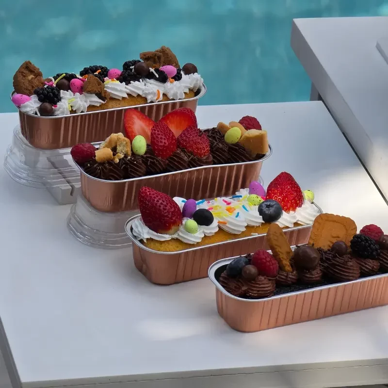 Individual Dolci cakes with berries, biscuits and sweet toppings